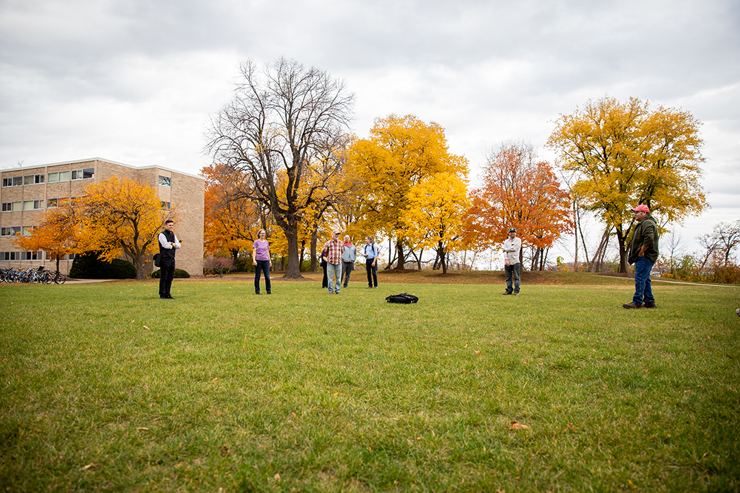 People standing on a grass lawn