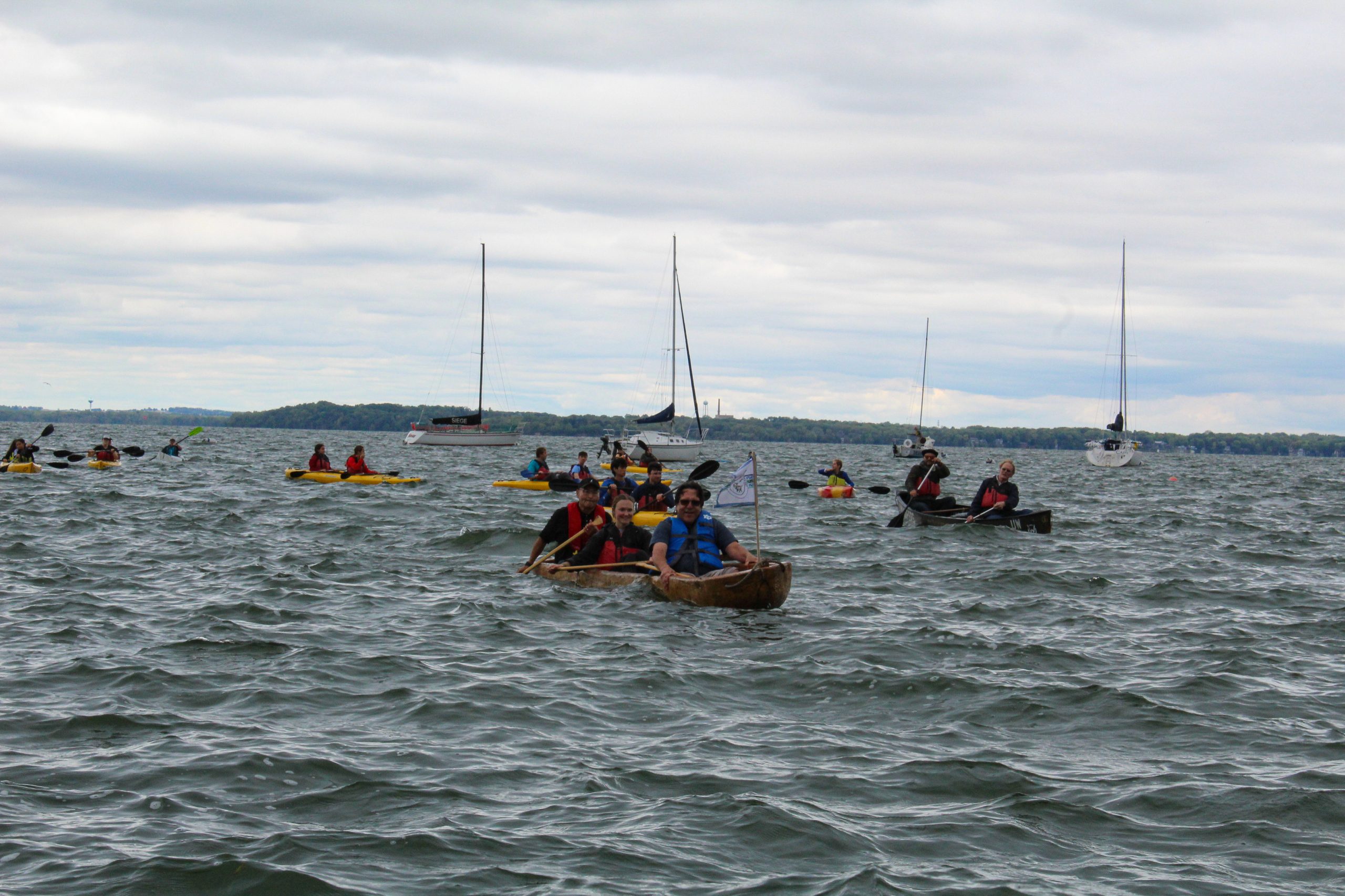Canoes on a body of water